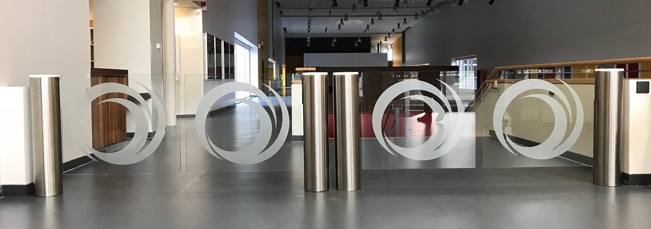 Swing gates with reinforced glass doors and a circle motif