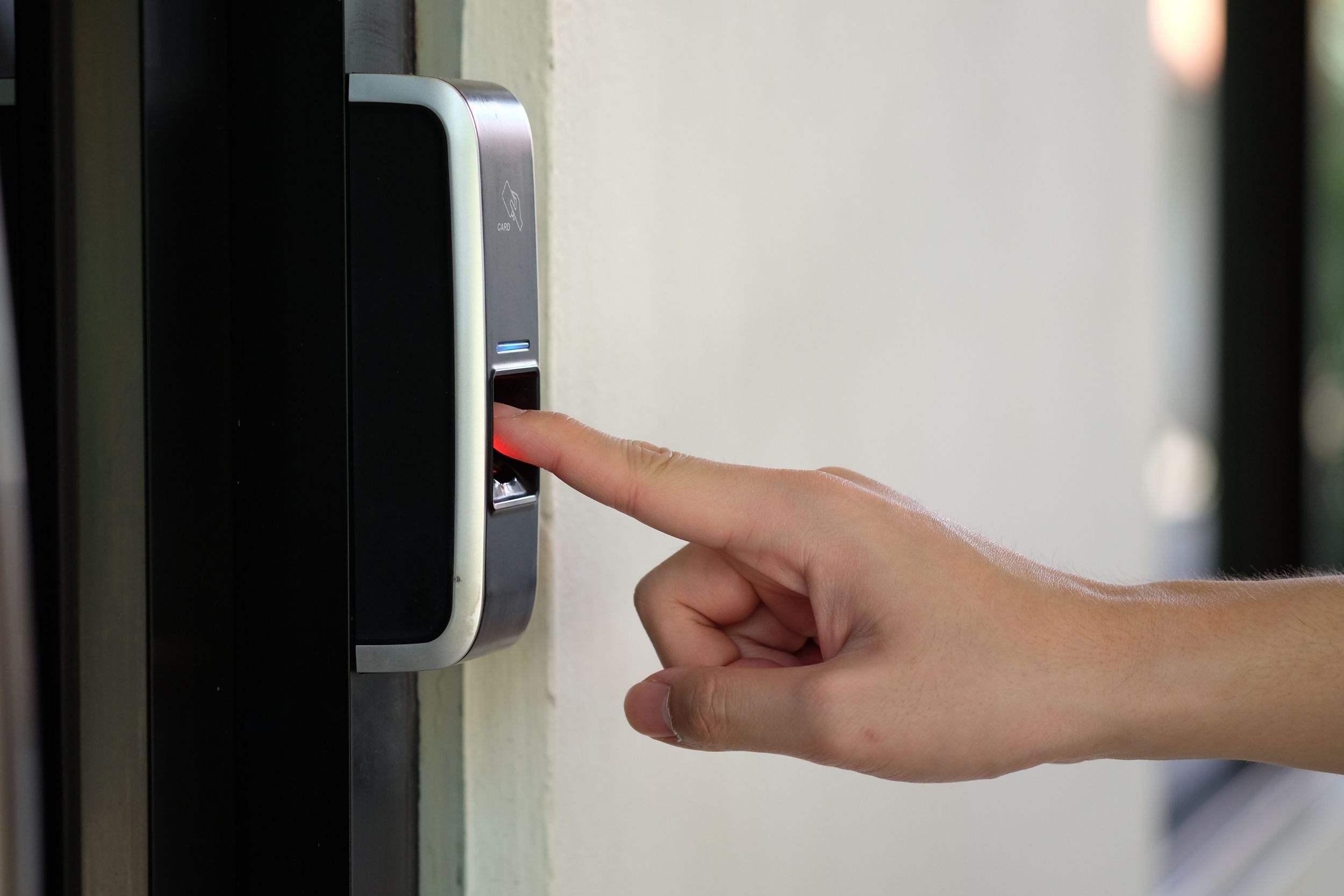 A hand in a fingerprint scanner