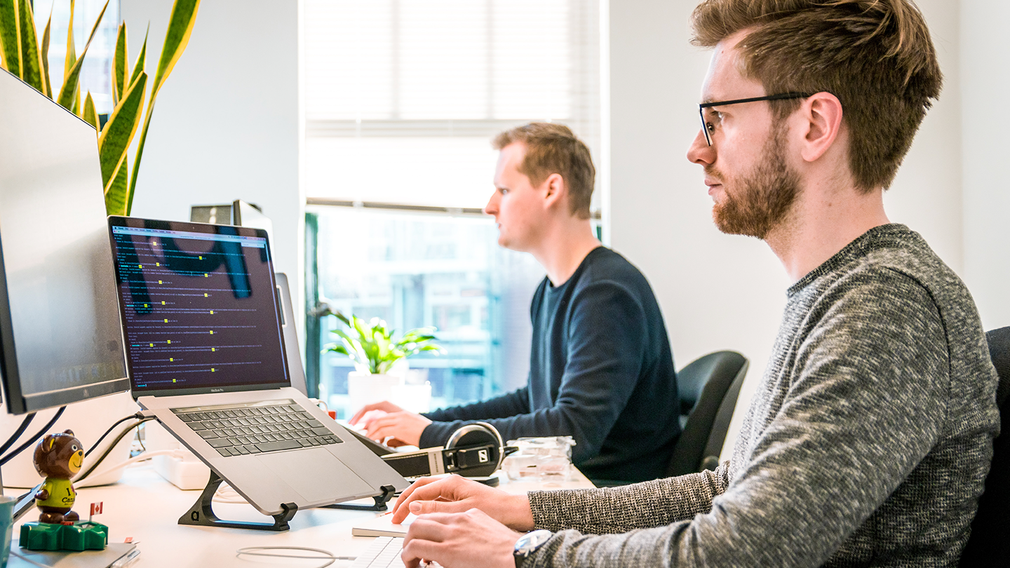 men working at their desk